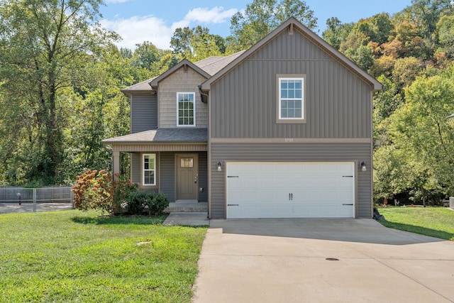 view of front of property with a garage and a front yard