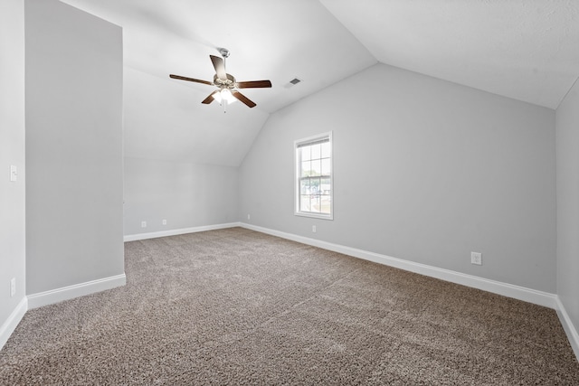 bonus room with carpet floors, vaulted ceiling, and ceiling fan