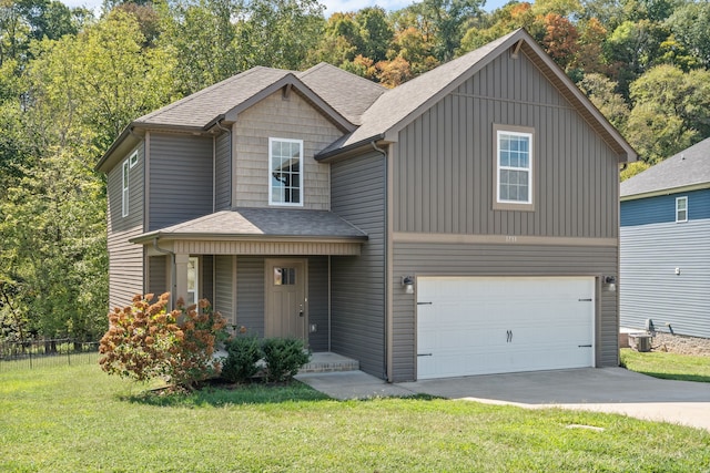 view of front of house featuring a garage and a front lawn