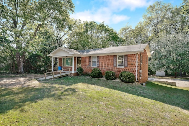 view of front facade with covered porch and a front yard