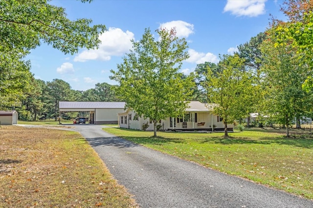 single story home with a porch and a front lawn