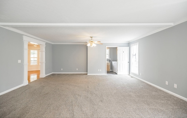 unfurnished living room with carpet flooring, decorative columns, ceiling fan, and a healthy amount of sunlight