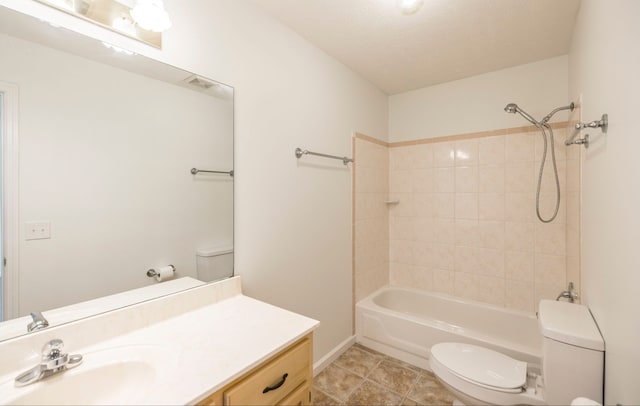 full bathroom with tiled shower / bath combo, tile patterned flooring, vanity, and toilet