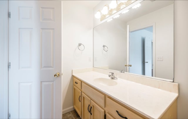 bathroom with tile patterned floors and vanity