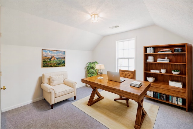 office with carpet flooring, a textured ceiling, and vaulted ceiling