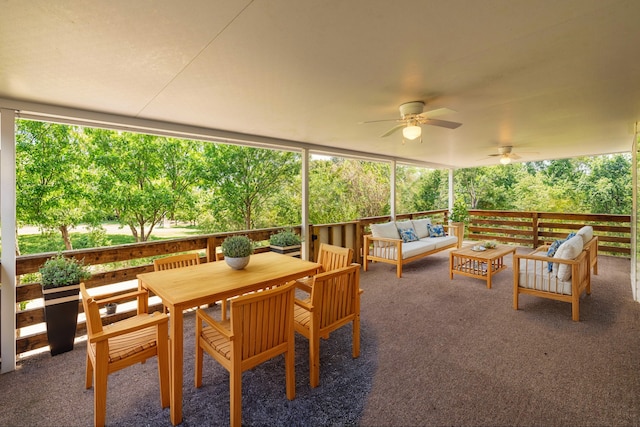 sunroom featuring ceiling fan