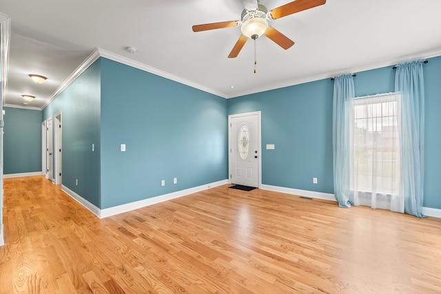 unfurnished room with ceiling fan, light wood-type flooring, and ornamental molding