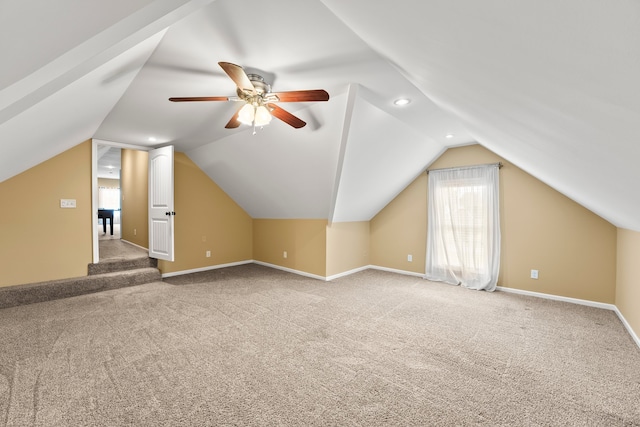 additional living space featuring lofted ceiling, ceiling fan, and carpet floors