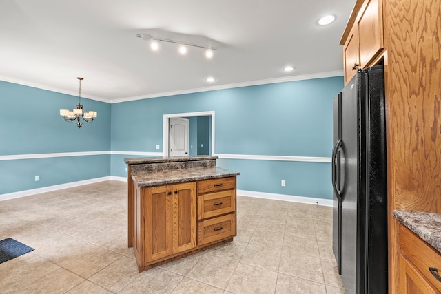 kitchen with pendant lighting, light tile patterned flooring, black refrigerator with ice dispenser, dark stone counters, and crown molding