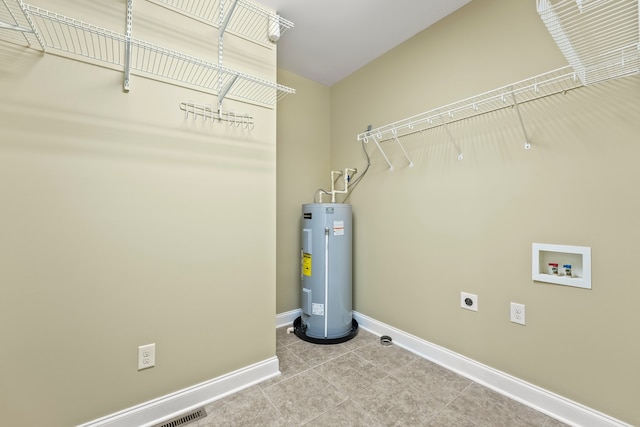 laundry room with hookup for an electric dryer, water heater, and hookup for a washing machine