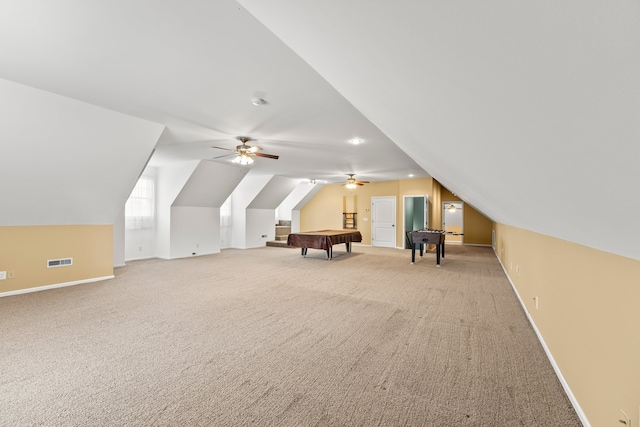 bonus room featuring carpet flooring, vaulted ceiling, and ceiling fan