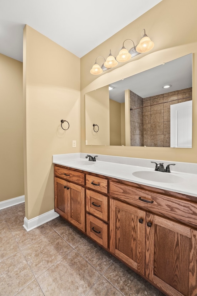 bathroom with tile patterned flooring and vanity