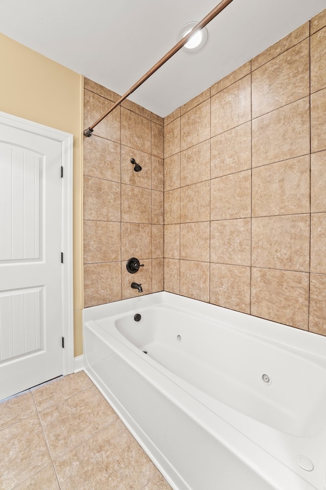 bathroom featuring tiled shower / bath combo and tile patterned floors