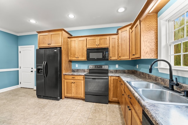 kitchen with black appliances, crown molding, sink, and light tile patterned floors