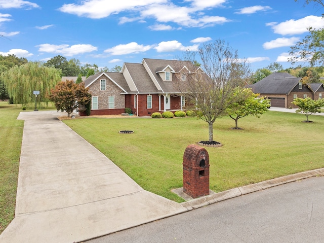 view of front facade with a front yard and a garage