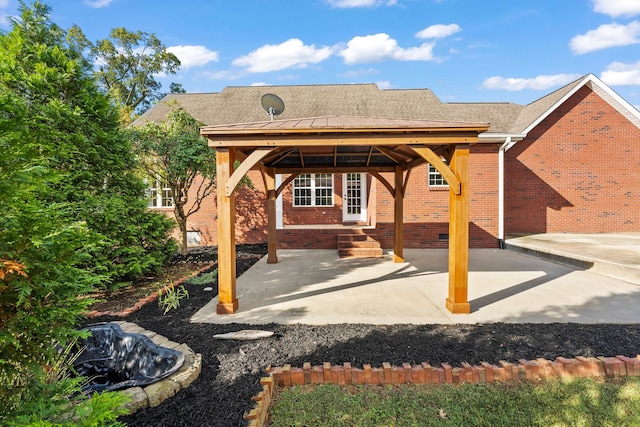 rear view of house featuring a gazebo