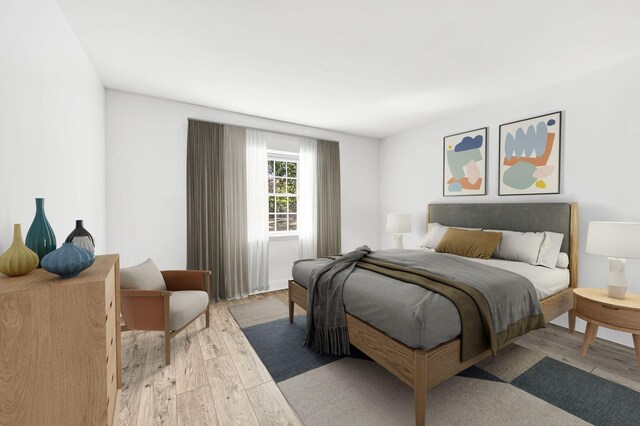 bedroom with light hardwood / wood-style floors