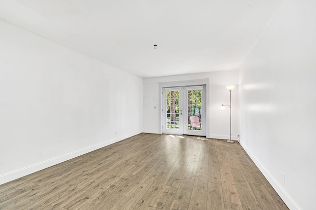 spare room featuring hardwood / wood-style floors