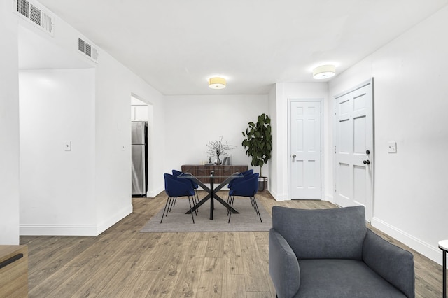 dining room with hardwood / wood-style flooring