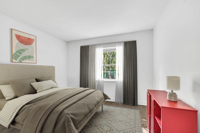 bedroom with wood-type flooring