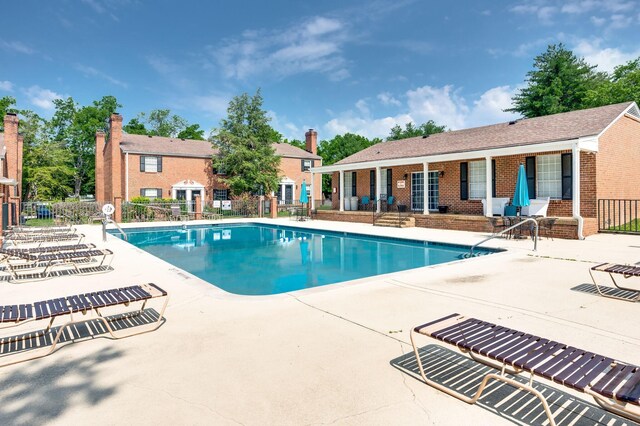 view of swimming pool with a patio