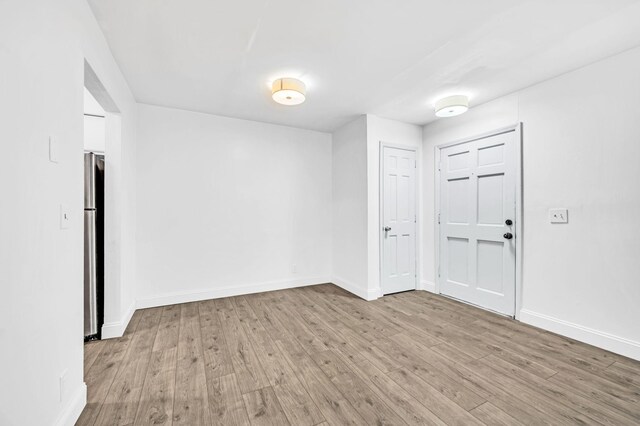 unfurnished room featuring light hardwood / wood-style flooring