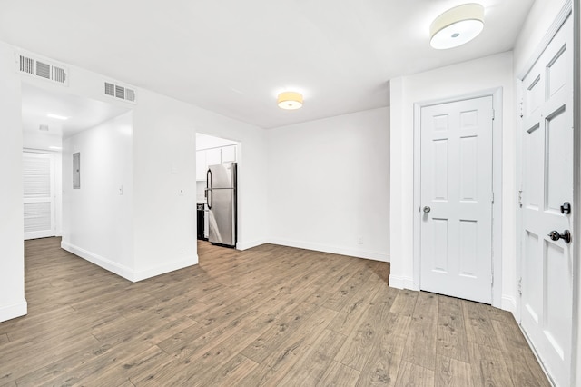 empty room featuring wood-type flooring