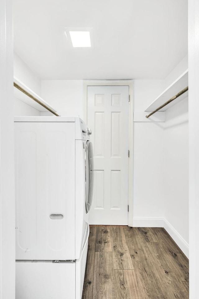 walk in closet featuring dark wood-type flooring