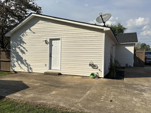 back of house with fence and a patio