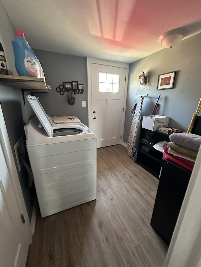 clothes washing area with washer / clothes dryer and hardwood / wood-style floors