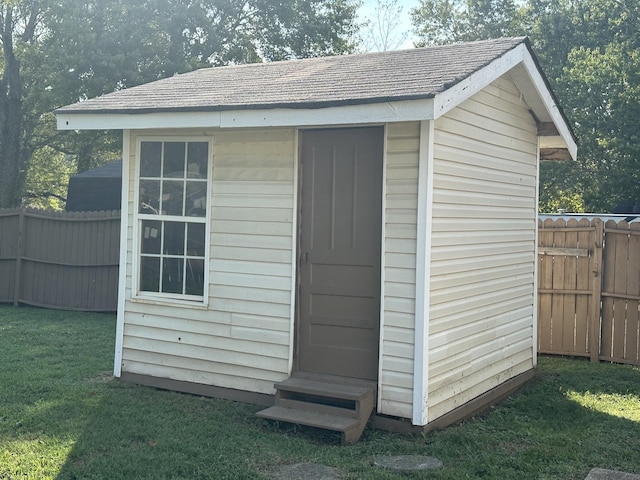 view of shed with fence