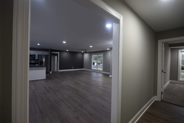 corridor featuring dark wood-type flooring