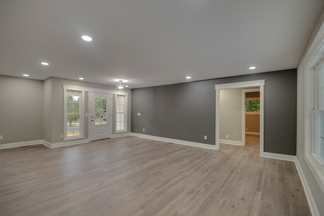 unfurnished room with light hardwood / wood-style floors