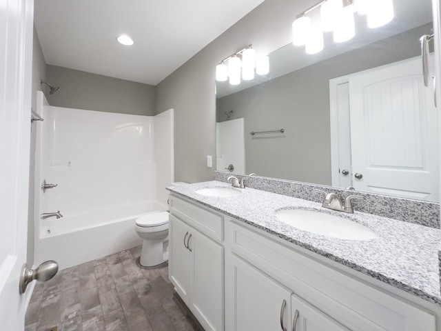 full bathroom with shower / bathing tub combination, vanity, toilet, and wood-type flooring