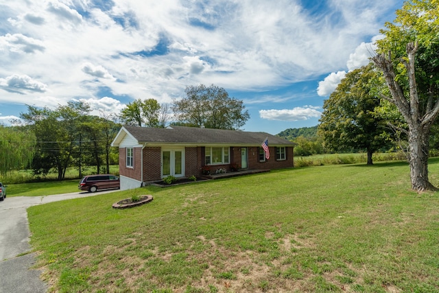 ranch-style home with a front yard