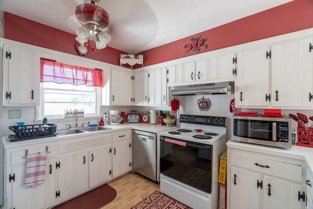 kitchen with stainless steel appliances and white cabinetry