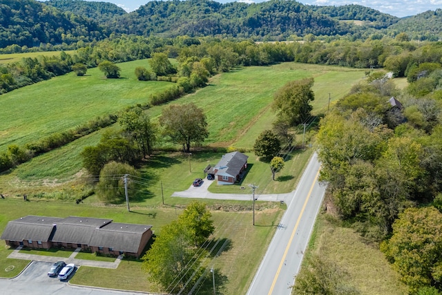 birds eye view of property with a rural view