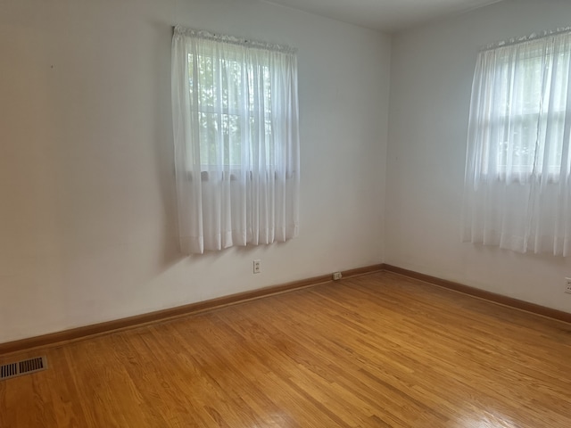 unfurnished room featuring light wood-type flooring