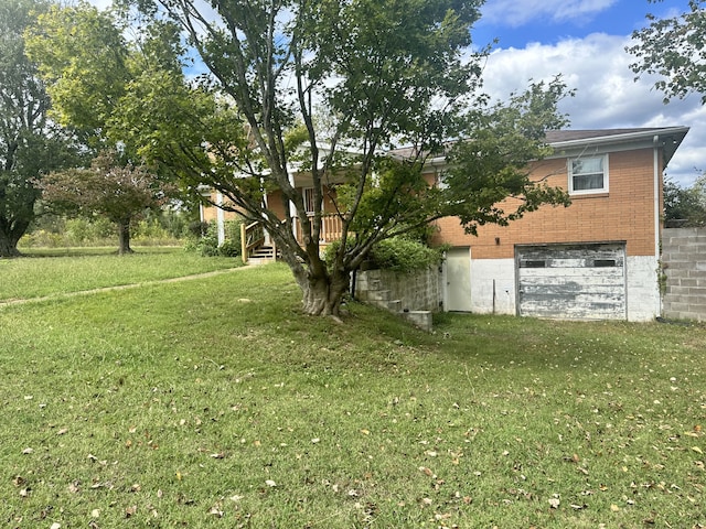 view of yard with a garage