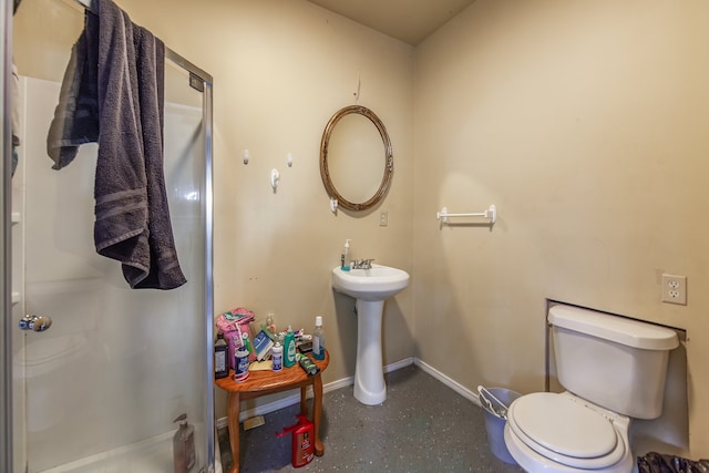 bathroom featuring toilet and an enclosed shower