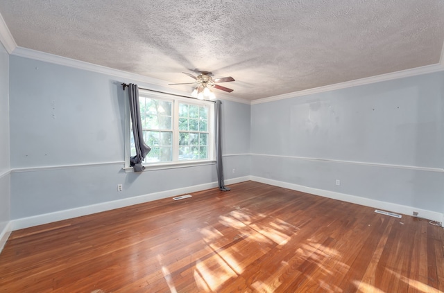 unfurnished room with ceiling fan, hardwood / wood-style flooring, ornamental molding, and a textured ceiling