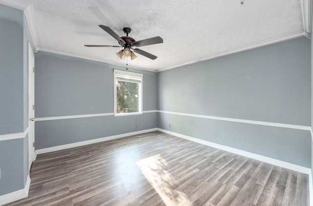 unfurnished room with wood-type flooring, ceiling fan, a textured ceiling, and crown molding