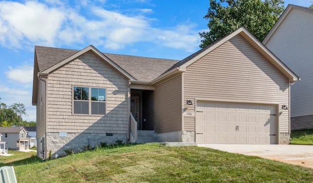 view of front of home with a garage and a front lawn