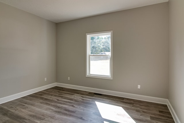 empty room featuring dark hardwood / wood-style floors