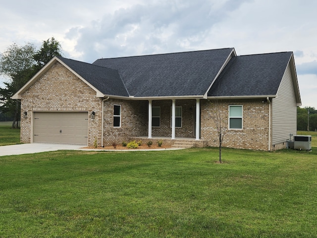 ranch-style house featuring a garage and a front lawn