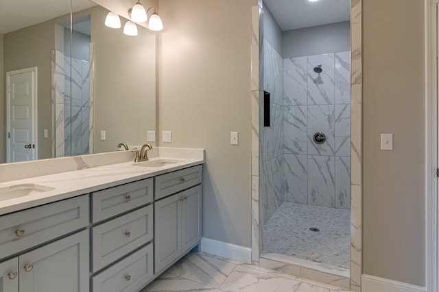 bathroom with vanity and tiled shower