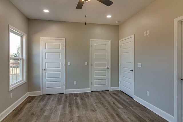 unfurnished bedroom with wood-type flooring and ceiling fan