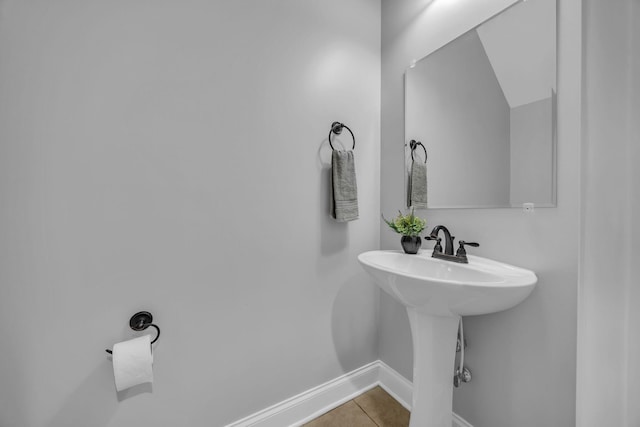 bathroom with tile patterned floors