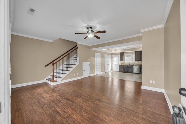 unfurnished living room featuring light hardwood / wood-style floors and crown molding