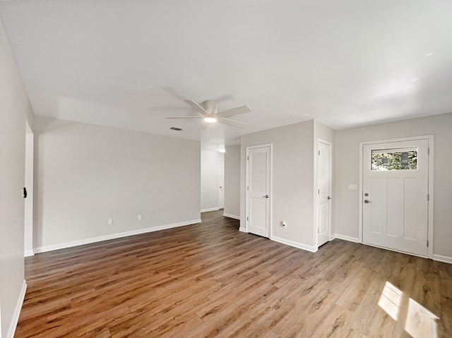 entryway with ceiling fan and light wood-type flooring